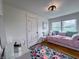 Cozy bedroom features a daybed, hardwood floors, and bright natural light at 4284 E County Road 100 S, Avon, IN 46123