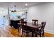 Open concept design shows the dining room with a dark wooden table and chairs that opens to the kitchen at 4284 E County Road 100 S, Avon, IN 46123