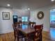Formal dining room with hardwood floors, traditional wood furniture, and neutral paint at 4284 E County Road 100 S, Avon, IN 46123