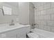 Updated bathroom featuring tiled shower over tub, a modern sink, and neutral color palette at 4432 Brittany Rd, Indianapolis, IN 46222