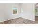 Bright bedroom with wood-look floors, a window, and a closet for storage space at 4432 Brittany Rd, Indianapolis, IN 46222