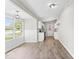 Open kitchen area with bright lighting and sleek, modern cabinets, flowing into the living area at 4432 Brittany Rd, Indianapolis, IN 46222