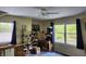 Bedroom with natural light, ceiling fan, and window views to the beautiful outdoor scenery at 448 Tamarack Ln, Noblesville, IN 46062