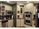 Modern kitchen with stainless steel appliances, ample storage, and warm countertops at 448 Tamarack Ln, Noblesville, IN 46062