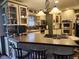 Well-equipped kitchen featuring updated appliances, granite countertops, and a center island with seating at 448 Tamarack Ln, Noblesville, IN 46062