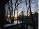 Lake view seen from the deck through bare trees at sunset and showing waterfront houses and docks at 448 Tamarack Ln, Noblesville, IN 46062