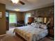 Comfortable main bedroom with large bed, carpet floors and window views to the beautiful outdoor scenery at 448 Tamarack Ln, Noblesville, IN 46062