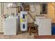 Basement laundry area with washer, dryer, and utility sink; well-lit for convenience at 4510 Gadsden St, Indianapolis, IN 46241