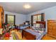 Bright bedroom featuring two beds, hardwood floors, and lots of sunlight at 4510 Gadsden St, Indianapolis, IN 46241