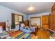Bedroom featuring wood floors, closet space, and natural light at 4510 Gadsden St, Indianapolis, IN 46241