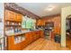 Rustic kitchen featuring brick accents, ample cabinet space, and vintage style fixtures at 4510 Gadsden St, Indianapolis, IN 46241
