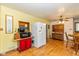 Bright eat-in kitchen with white appliances and vintage cabinetry that offers plenty of storage at 4510 Gadsden St, Indianapolis, IN 46241