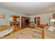 Spacious living room featuring hardwood floors, arched doorways, and easy access to other rooms at 4510 Gadsden St, Indianapolis, IN 46241