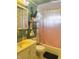 Bathroom featuring a unique yellow sink, a shelf, and a decorative shower curtain at 4820 Nowland Ave, Indianapolis, IN 46201