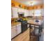 Functional kitchen with butcher block countertops, white cabinets, and modern appliances at 4820 Nowland Ave, Indianapolis, IN 46201
