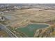 Aerial view of the community showcasing home sites, ponds, and road at 50 Benfield Dr, Whiteland, IN 46184