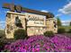 Stone community sign with flowers in Saddlebrook Farms North at 50 Benfield Dr, Whiteland, IN 46184