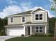 Charming two-story home with a combination of brick and siding, complemented by a well-manicured lawn at 50 Benfield Dr, Whiteland, IN 46184