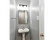 Compact bathroom with a pedestal sink, neutral wall color, and modern fixtures at 5005 Whisenand Dr, Indianapolis, IN 46254