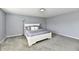Cozy bedroom featuring neutral walls, soft carpet, and is decorated with a plush queen-size bed at 5005 Whisenand Dr, Indianapolis, IN 46254