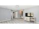 Bright bedroom with hardwood flooring, neutral walls, and access to an adjacent bathroom at 5005 Whisenand Dr, Indianapolis, IN 46254