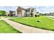 Well-kept lawn and neat landscaping enhance this home's curb appeal in a quiet neighborhood at 5005 Whisenand Dr, Indianapolis, IN 46254