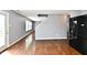 Open layout showcasing hardwood floors that connects the kitchen and living spaces at 5005 Whisenand Dr, Indianapolis, IN 46254