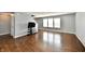 Bright, open living room with hardwood floors and large windows for ample natural light at 5005 Whisenand Dr, Indianapolis, IN 46254