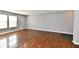 Spacious living room with gleaming hardwood floors and fresh neutral paint at 5005 Whisenand Dr, Indianapolis, IN 46254