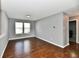 Inviting living room featuring hardwood floors and plenty of natural light from the large window at 5005 Whisenand Dr, Indianapolis, IN 46254