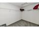 This walk-in closet has carpeted floors, wire shelving, and ample storage space at 5005 Whisenand Dr, Indianapolis, IN 46254