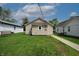 Charming home with lush green backyard and well-maintained landscaping at 52 N Ross St, Columbus, IN 47201