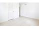 Bright bedroom with neutral paint, tile flooring, and closet at 52 N Ross St, Columbus, IN 47201
