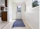 Bright entryway featuring a tiled floor and a door leading to the outside at 52 N Ross St, Columbus, IN 47201