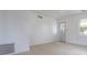 Bright, airy living room features tile floors and a light-filled doorway at 52 N Ross St, Columbus, IN 47201
