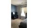 Serene bedroom with natural light and a stylish accent wall at 562 Harmony Dr, Greenwood, IN 46143
