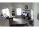 Well-lit living room with a fireplace, modern flooring, and cozy seating area at 562 Harmony Dr, Greenwood, IN 46143