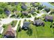 Aerial view showcasing the property's prime location within a well-maintained residential area, with landscaped yards and mature trees at 5942 Tioga Ct, Bargersville, IN 46106
