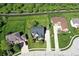 Aerial view showcasing the property's manicured lawn, established trees, and desirable location within a residential neighborhood at 5942 Tioga Ct, Bargersville, IN 46106