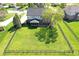Aerial view featuring a spacious backyard with a fence, mature trees, and a charming screened-in porch at 5942 Tioga Ct, Bargersville, IN 46106