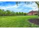 Private backyard boasts green lawn and privacy fence, offering a serene outdoor space for leisure and recreation at 5942 Tioga Ct, Bargersville, IN 46106