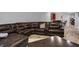 Spacious basement with a large leather sectional and wet bar, perfect for entertaining and relaxing in style at 5942 Tioga Ct, Bargersville, IN 46106