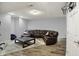 Finished basement with a comfortable leather sectional, offering a spacious and inviting recreational area at 5942 Tioga Ct, Bargersville, IN 46106