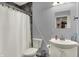 Neutral bathroom featuring a shower and tub combination, white sink, and modern finishes at 5942 Tioga Ct, Bargersville, IN 46106