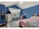Bright bedroom with vaulted ceilings, a large window, and stylish decor, offering a comfortable and appealing living space at 5942 Tioga Ct, Bargersville, IN 46106