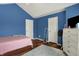 Spacious bedroom showcasing light-colored walls, hardwood floors, and ample natural light, providing a serene and inviting retreat at 5942 Tioga Ct, Bargersville, IN 46106