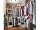 Walk-in closet with custom wood shelving and hanging storage at 5942 Tioga Ct, Bargersville, IN 46106