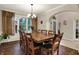 Elegant dining room with hardwood floors, large table, and natural light at 5942 Tioga Ct, Bargersville, IN 46106