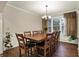 Elegant dining room with hardwood floors, large table, and natural light at 5942 Tioga Ct, Bargersville, IN 46106