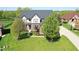Stunning two-story brick home with well-manicured lawn and mature trees at 5942 Tioga Ct, Bargersville, IN 46106